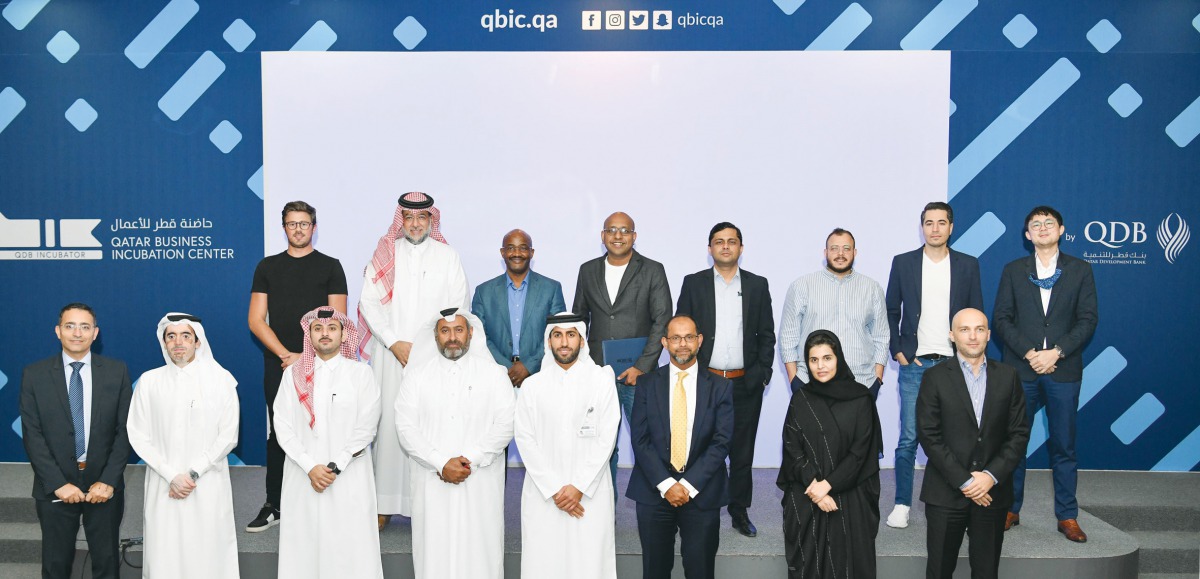 Officials of Qatar Development Bank and Qatar Business Incubation Center with the winners of the 14th wave of the LeanStartup Program in Doha recently. 