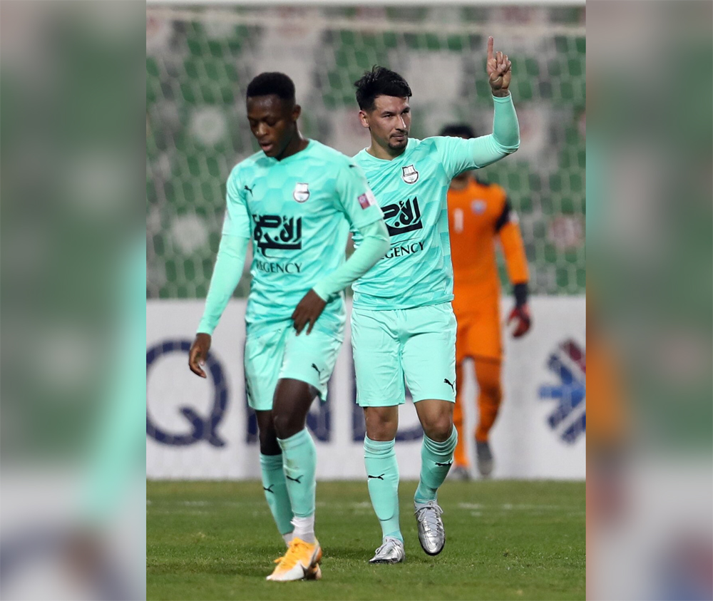 Al Ahli's Hernan Perez (right) celebrates his goal against Al Kharaitiyat, yesterday.  