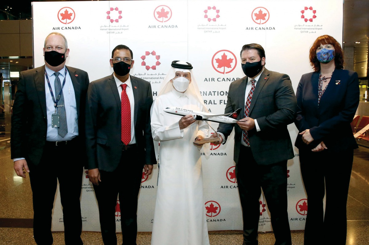 Qatar Airways Group Chief Executive H E Akbar Al Baker with other officials during a ceremony to welcome the inaugural Air Canada flight.