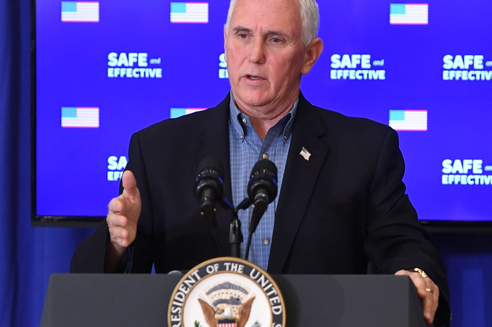 US Vice President Mike Pence speaks after receiving the COVID-19 vaccine in the Eisenhower Executive Office Building in Washington, DC, December 18, 2020. / AFP / SAUL LOEB
