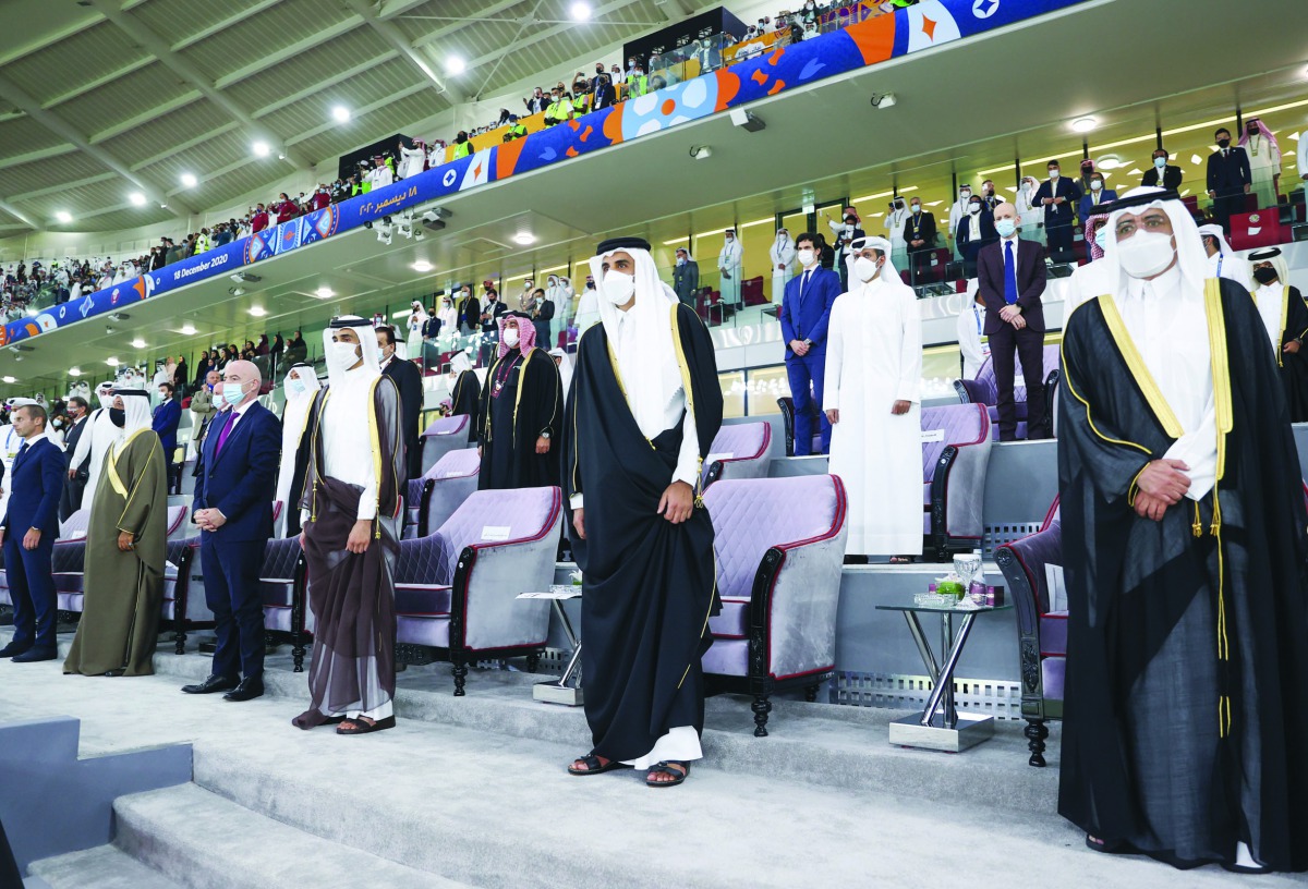Amir H H Sheikh Tamim bin Hamad Al Thani and other dignitaries stand in honour of the Qatar national anthem being played at Ahmed Bin Ali Stadium moments before the start of the Amir Cup final. 