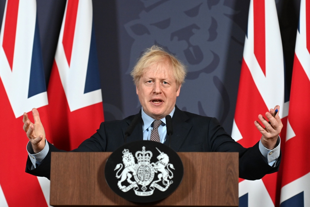 Britain's Prime Minister Boris Johnson gestures as he holds a remote press conference to update the nation on the post-Brexit trade agreement, inside 10 Downing Street in central London on December 24, 2020. (AFP / Paul Grover)