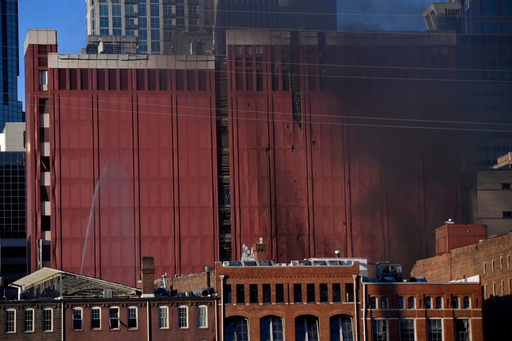 Smoke billows from the site of an explosion in the area of Second and Commerce in Nashville, Tennessee, U.S. December 25, 2020. (Andrew Nelles/Tennessean.com via Reuters)