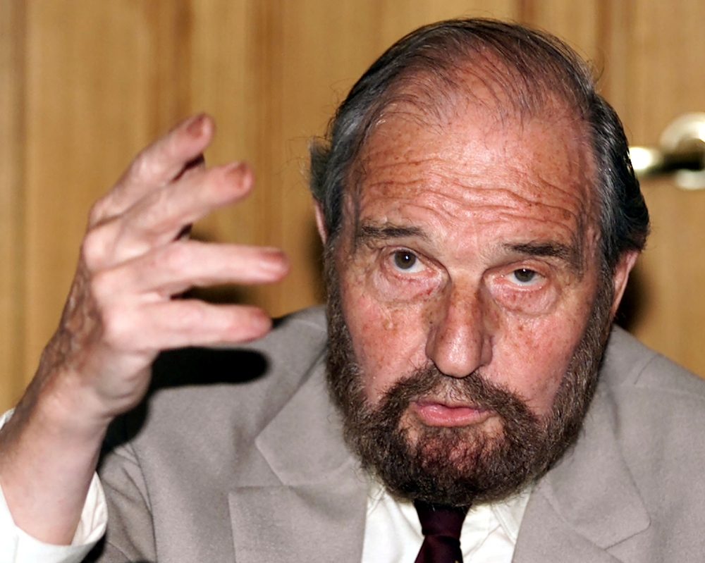 FILE PHOTO: Soviet secret agent George Blake gestures as he speaks at a presentation of a book of letters written by other spies from a British prison, in Moscow June 28, 2001.
