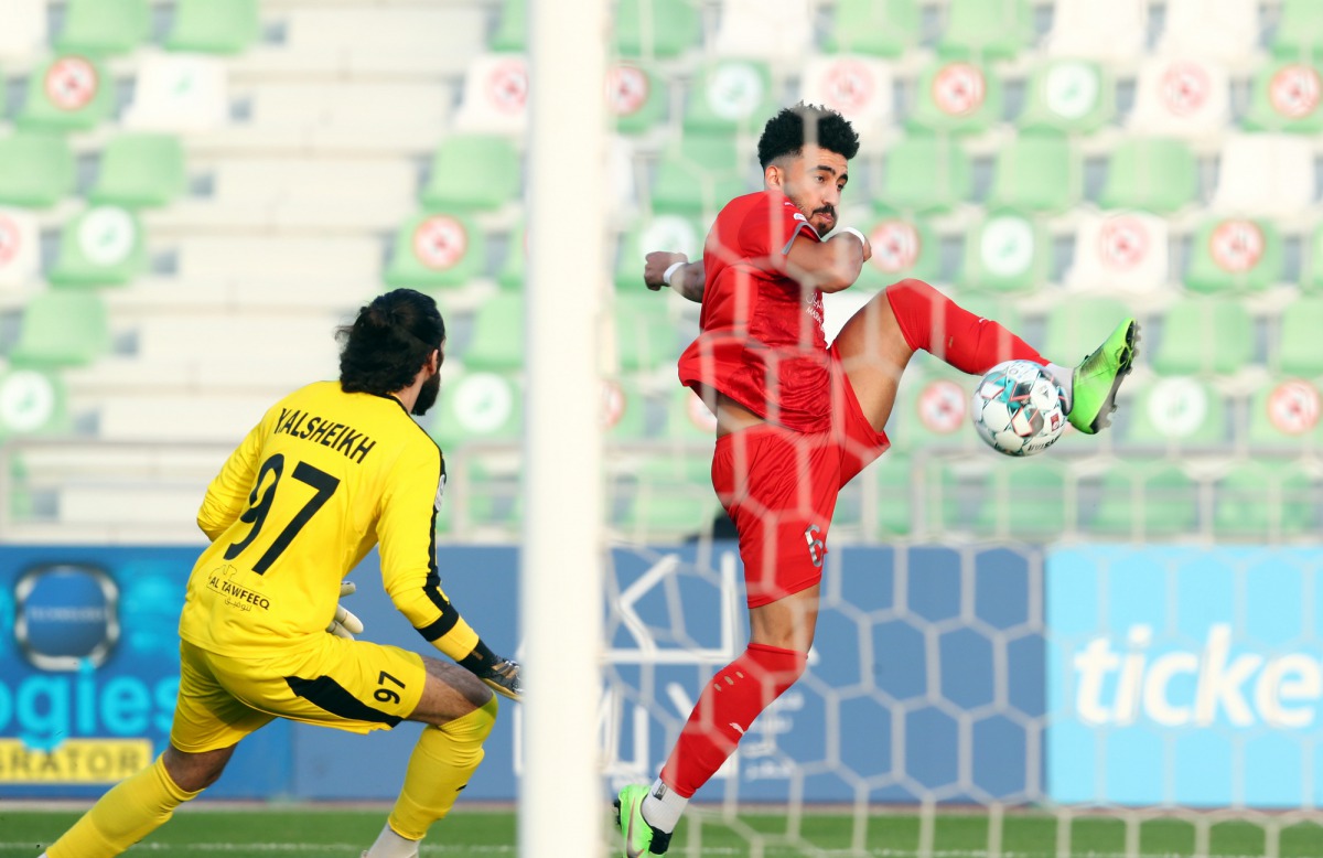 Al Duhail's Ahmed Yasser scores his team's second goal against Al Ahli during yesterday's match.