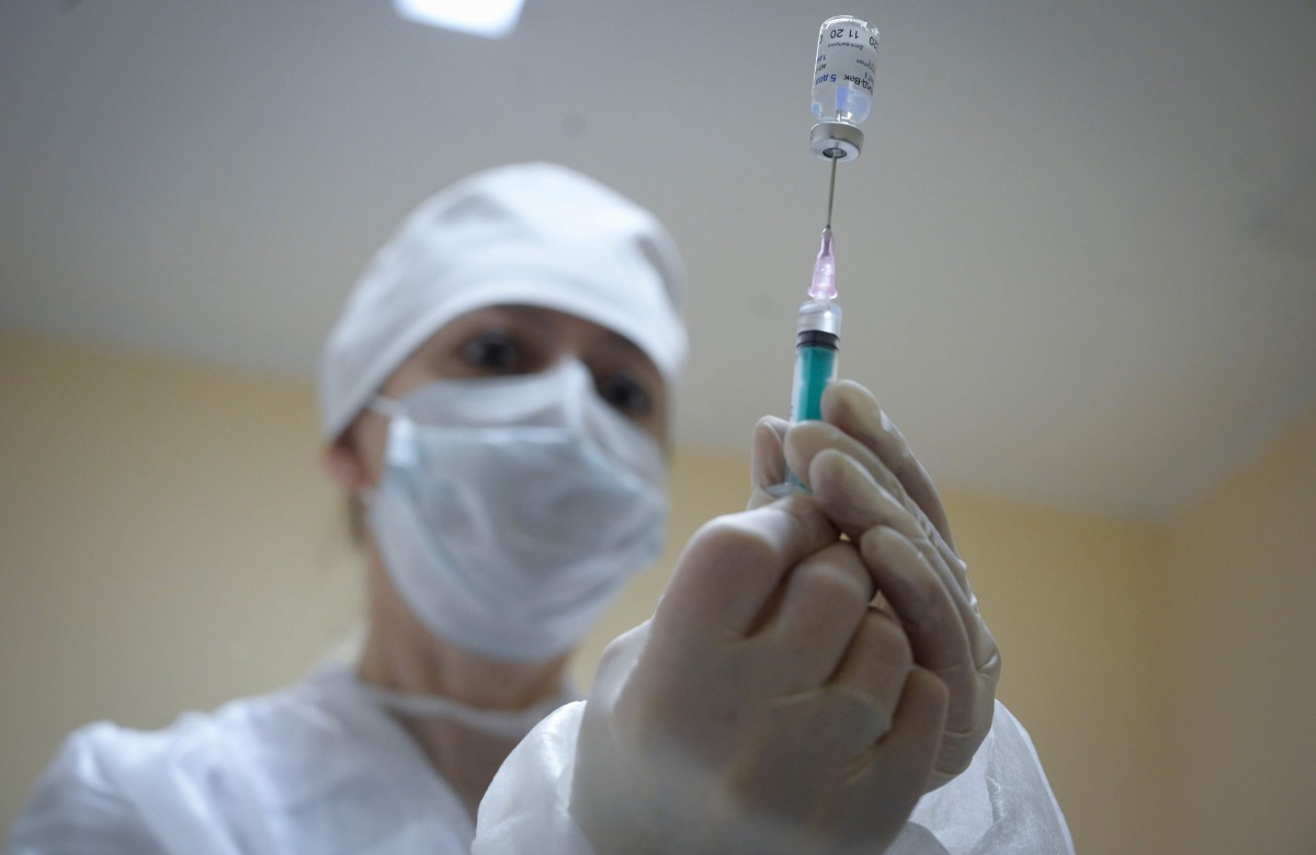 A nurse prepares dose of the Sputnik V (Gam-COVID-Vac) Covid-19 vaccine for a patient at a clinic in Moscow on December 30, 2020, as the country started its vaccination campaign for people aged 60 and over, to fight against the spread of the novel coronav