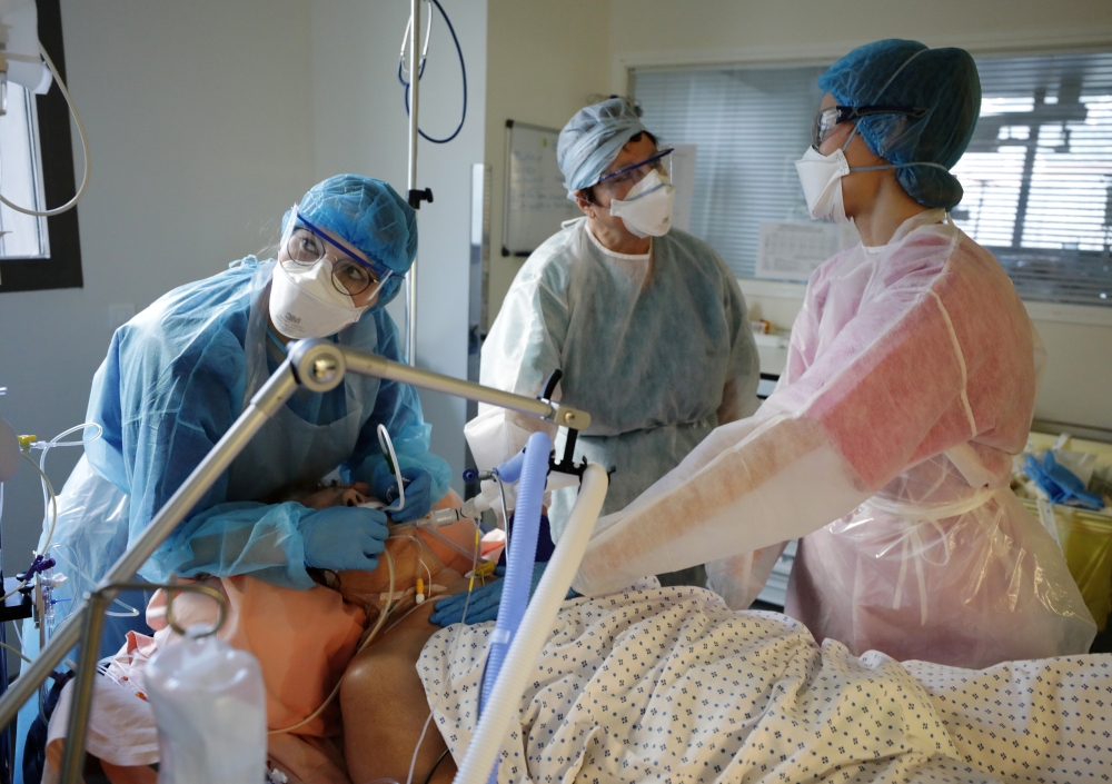 FILE PHOTO: Medical staff members work in the ICU where patients suffering from the coronavirus are treated at the Pasteur hospital in Nice, France, November 27, 2020. REUTERS/Eric Gaillard