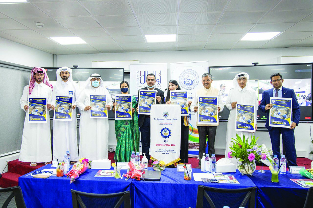 Ambassador of India to Qatar, Dr. Deepak Mittal, and President of Arab Engineers Forum, Eng. Jassim Ahmed Al Jolo, with other officials during souvenir release at the event.