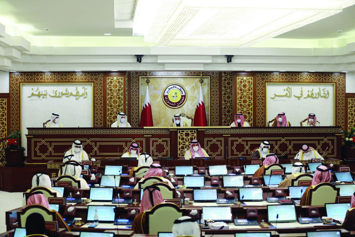 Speaker of Shura Council, H E Ahmed bin Abdullah bin Zaid Al Mahmoud; Minister of Administrative Development, Labour and Social Affairs, H E Yousuf bin Mohamed Al Othman Fakhroo; and other dignitaries attending the Shura Council meeting yesterday. 