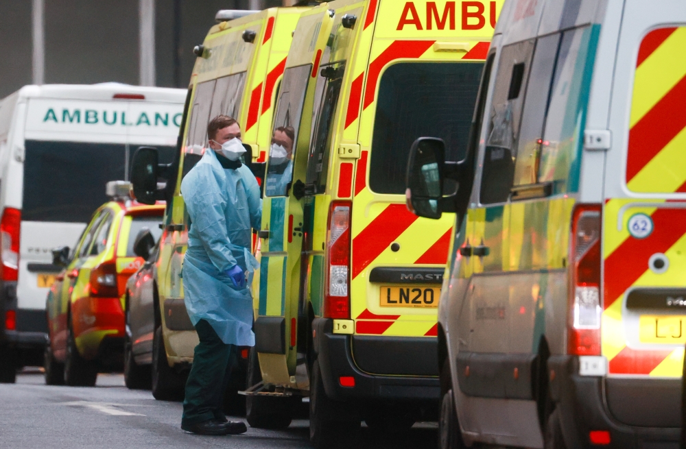 A medic stands next to an ambulance at the Royal London Hospital, amid the coronavirus disease outbreak, in London, Britain, January 5, 2021. Reuters/Hannah McKay