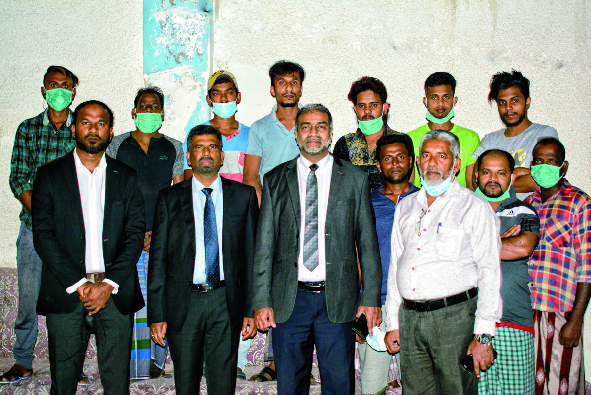 A group of Sri Lankan expatriate workers with Charge d’Affaires of the Sri Lanka embassy in Doha, Ratnasingam Kohularangan; Counsellor Employment and Welfare Rasika Jayasinghe; and other officials at the Embassy