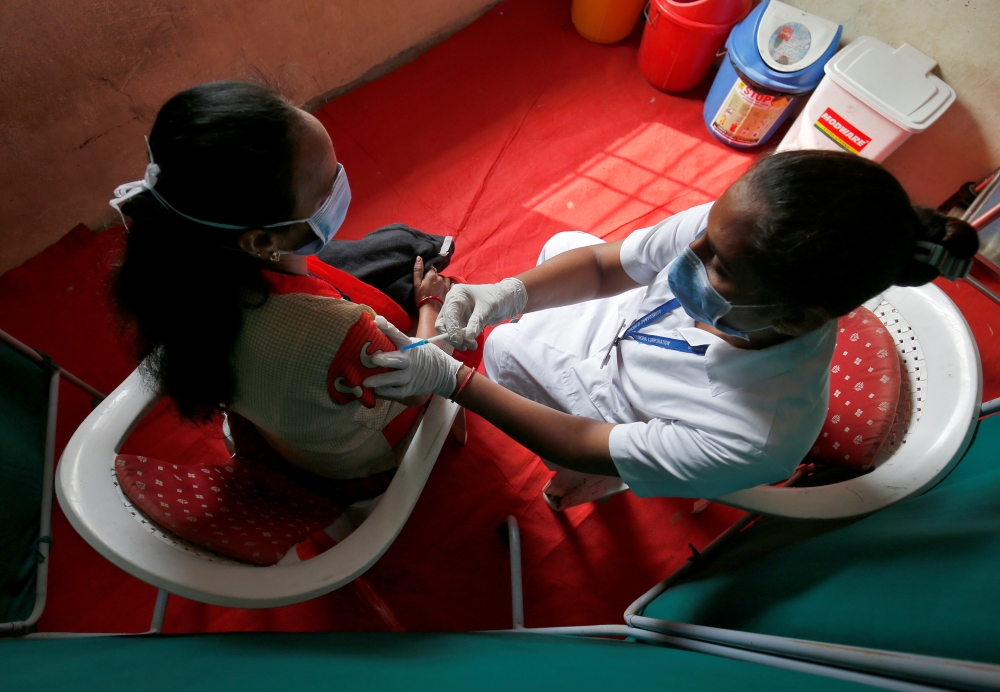 Healthcare workers take part in a nationwide trial run of Covid-19 vaccine delivery systems on the outskirts of Ahmedabad, India, January 8, 2021. Reuters/Amit Dave