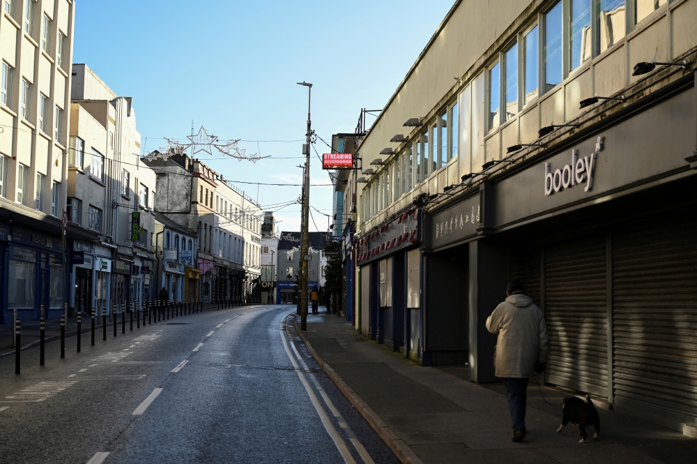 FILE PHOTO: An empty city centre shopping streets is seen after the government imposed the highest level of restrictions amid the spread of the coronavirus disease (COVID-19) pandemic, in Galway, Ireland, January 1, 2021. REUTERS/Clodagh Kilcoyne