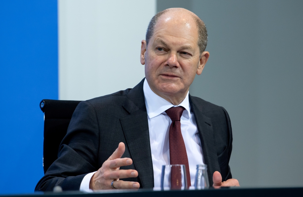 FILE PHOTO: German Finance Minister Olaf Scholz attends a news conference following talks with state leaders to discuss anti-coronavirus measures at the Chancellery in Berlin, Germany December 13, 2020. Bernd von Jutrczenka/Pool via REUTERS