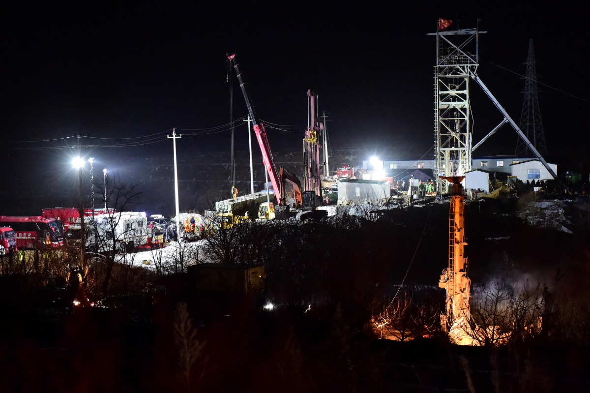 Rescue teams work on saving workers trapped underground after an explosion at the gold mine under construction in Qixia, Shandong province, China, January 12, 2021. Picture taken January 12, 2021. cnsphoto via REUTERS