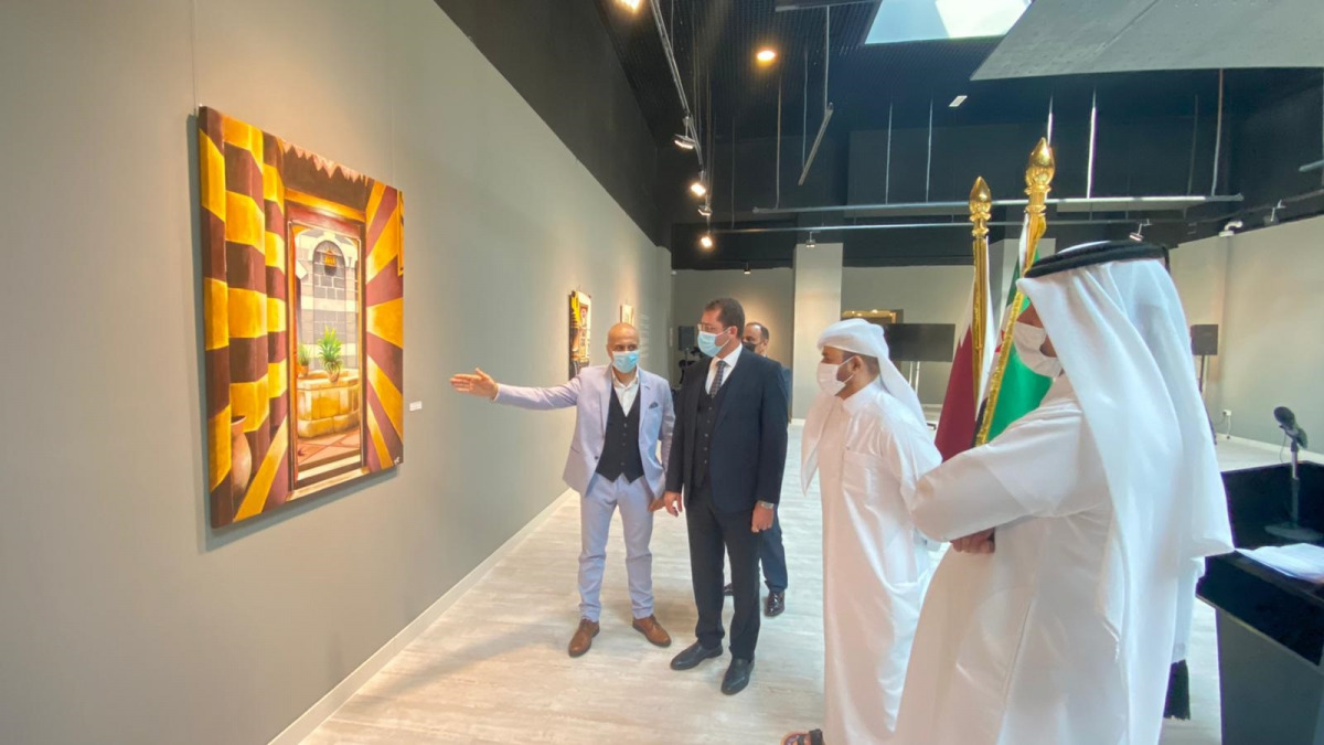 Syrian artist Salah Eddin Al Bizri (left), explains one of his artworks to Katara General Manager Dr. Khalid bin Ibrahim Al Sulaiti (second right) and other guests at the opening of “Damascus, levant” exhibition at Katara Building 18 yesterday.