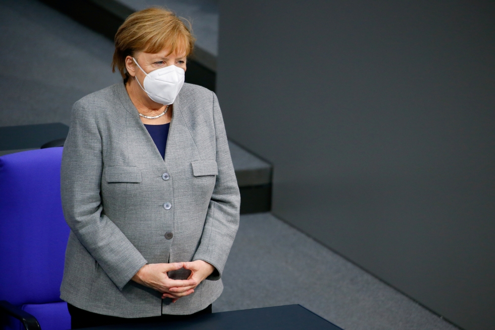 German Chancellor Angela Merkel attends a session at the lower house of parliament Bundestag on the start of the coronavirus disease (COVID-19) vaccinations, in Berlin, Germany, January 13, 2021. REUTERS/Michele Tantussi/File Photo