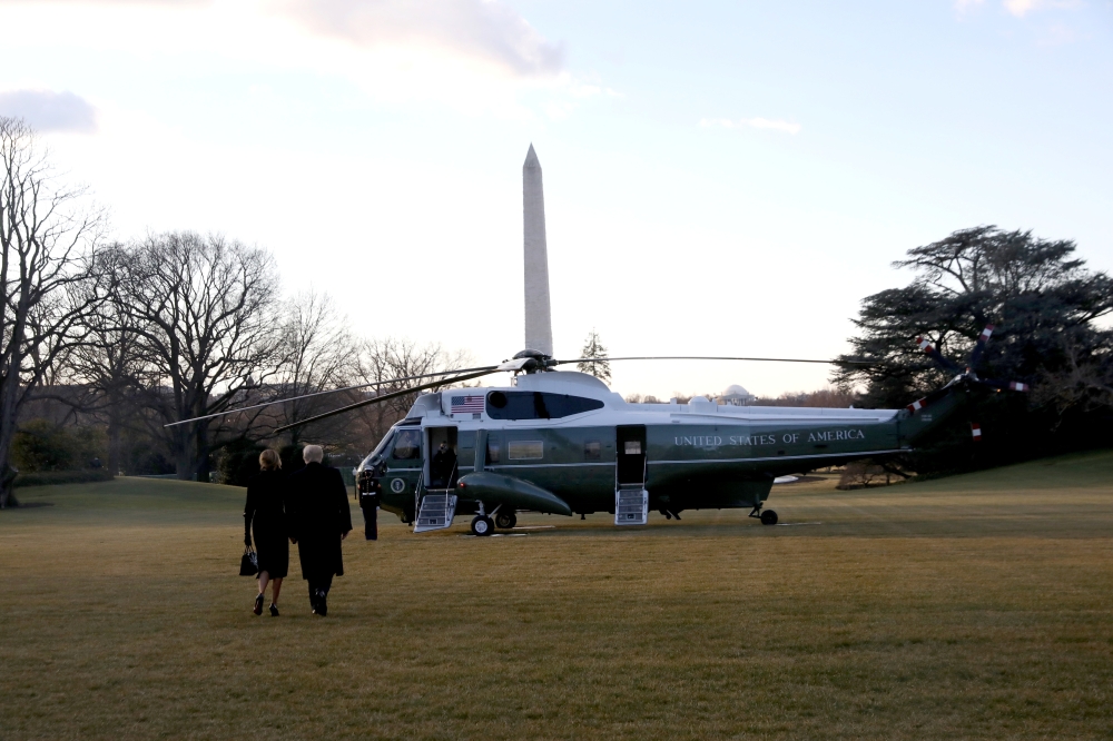 U.S. President Donald Trump and first lady Melania Trump depart the White House to board Marine One ahead of the inauguration of president-elect Joe Biden, in Washington, U.S., January 20, 2021. REUTERS/Leah Millis