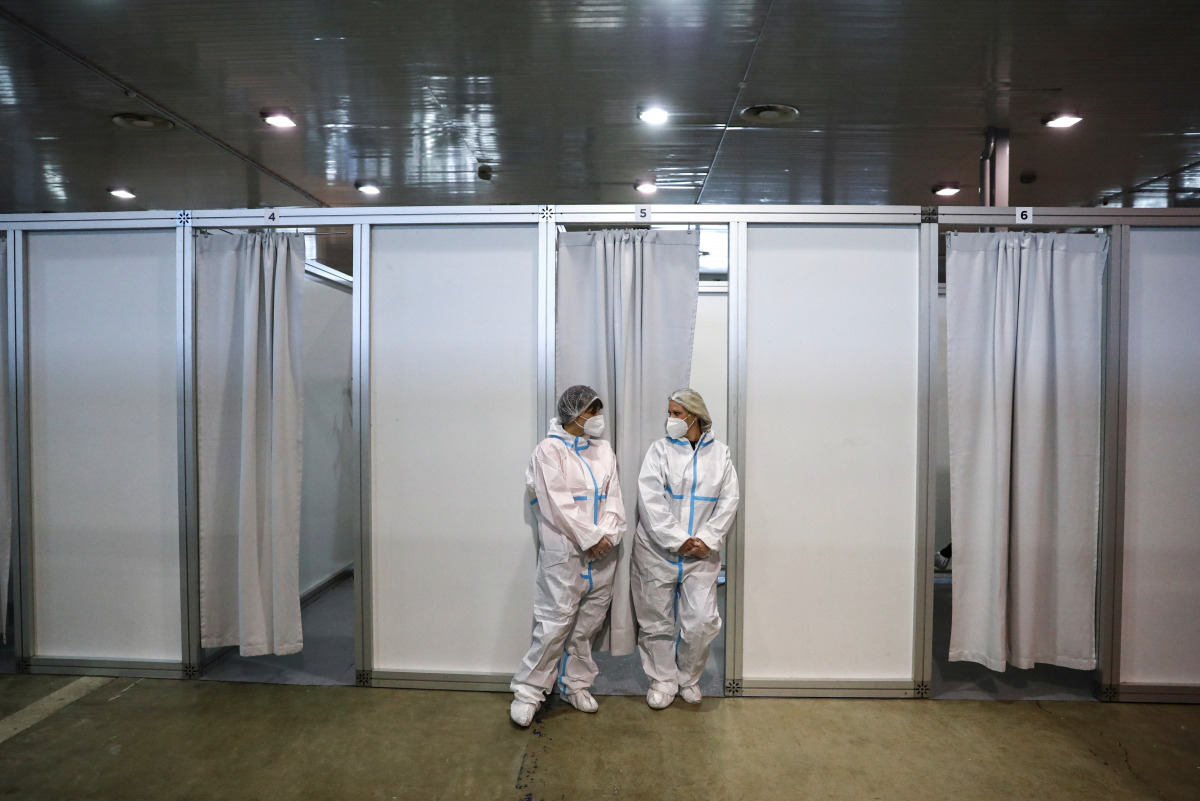 Medical workers take a brake from vaccinating Serbian Army officers with the Chinese Sinopharm vaccines as the country begins mass vaccination for the coronavirus disease (COVID-19), in Belgrade, Serbia, January 19, 2021. REUTERS/Marko Djurica
