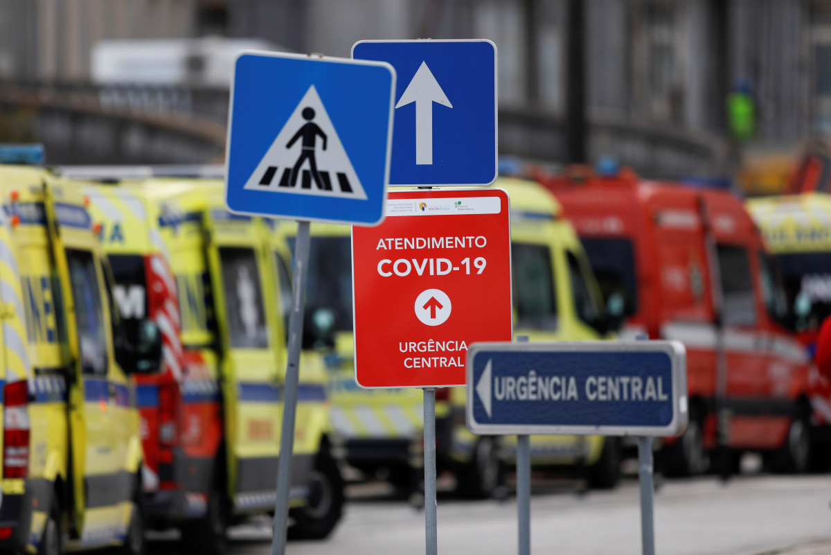 FILE PHOTO: Signs are seen as ambulances carrying patients with the coronavirus disease (COVID-19) queued outside the Santa Maria Hospital, as the coronavirus disease (COVID-19) outbreak continues, in Lisbon, Portugal, January 22, 2021. REUTERS/Pedro Nune