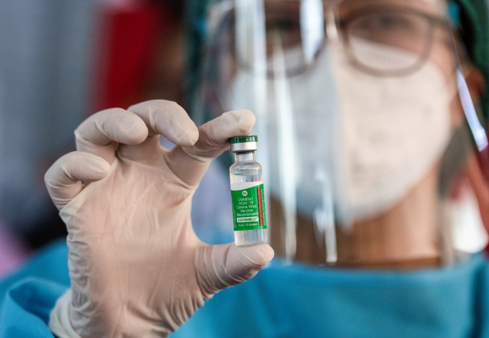 A medic shows a vial of AstraZeneca's COVISHIELD coronavirus disease (COVID-19) vaccine in Yangon, Myanmar, after the country received 1.5 million doses of the vaccine manufactured by the Serum Institute of India, January 27, 2021. REUTERS/Shwe Paw Mya Ti