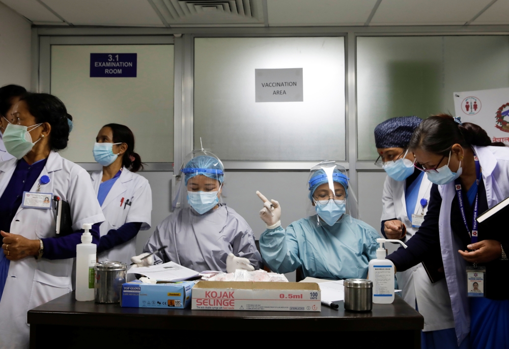 Health workers prepare to start vaccination against the coronavirus disease (COVID-19) in Kathmandu, Nepal January 27, 2021. REUTERS/Navesh Chitrakar
