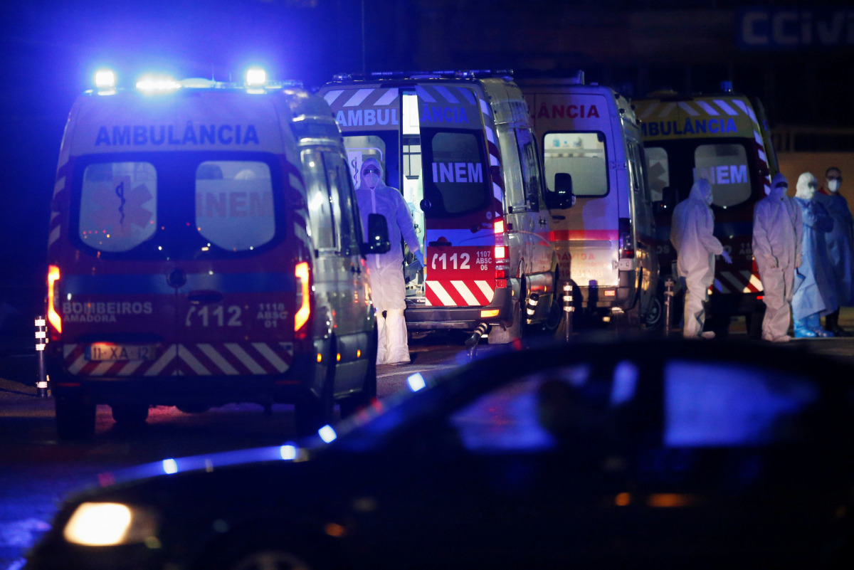Ambulances with COVID-19 patients are seen waiting in Santa Maria hospital, as COVID-19 patients are being transferred from another hospital after a oxygen supply malfunction, amid the coronavirus disease (COVID-19) pandemic in Lisbon, Portugal, January 2