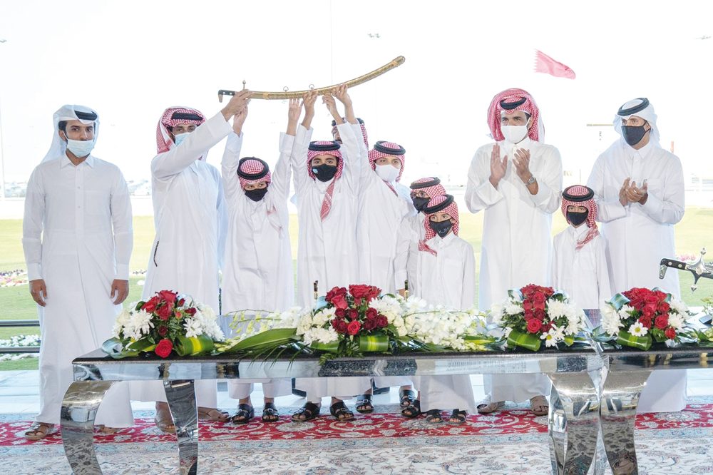 President of the Qatar Olympic Committee, H E Sheikh Joaan bin Hamad Al Thani, honouring the winners of the main ten rounds of the annual purebred Arabian Camel Festival for the sword of H H the Father Amir Sheikh Hamad bin Khalifa Al Thani.