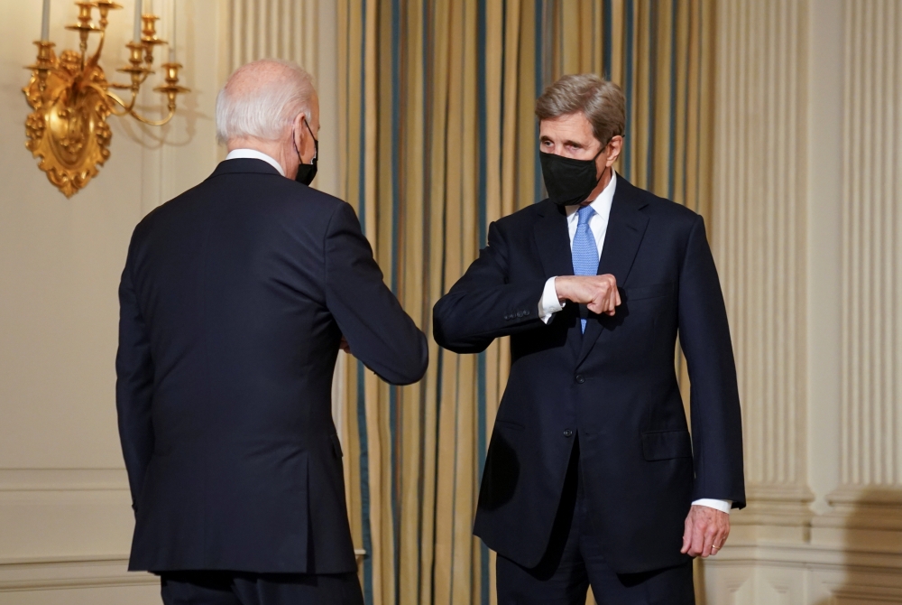 White House climate envoy John Kerry greets U.S. President Joe Biden as Biden arrives to speak about tackling climate at the White House in Washington, US, January 27, 2021. Reuters/Kevin Lamarque