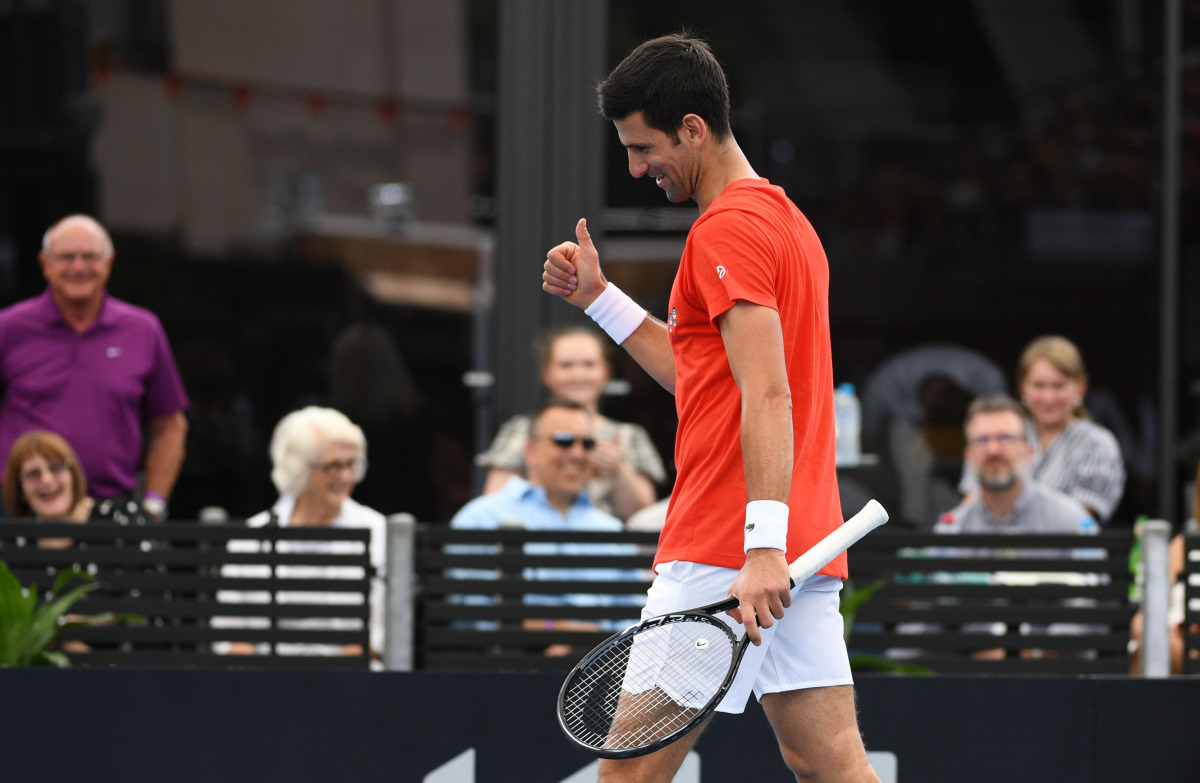 Tennis - A Day at the Drive Exhibition - Memorial Drive Tennis Club, Adelaide, Australia - January 29, 2021 Serbia's Novak Djokovic reacts during his first match against Italy's Jannik Sinner at A Day at The Drive REUTERS/Morgan Sette
