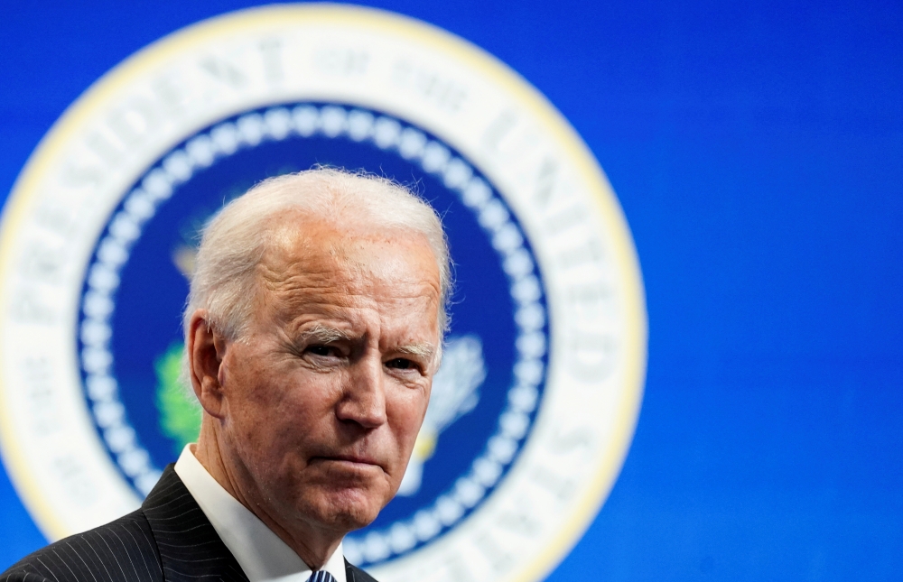 U.S. President Joe Biden speaks speaks during a brief appearance at the White House in Washington, U.S., January 25, 2021. REUTERS/Kevin Lamarque/File Photo