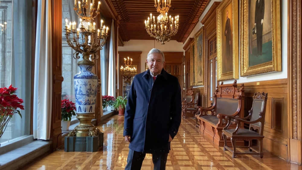 Mexico's President Andres Manuel Lopez Obrador smiles as he broadcasts a message saying he passed the critical phase of infection of the coronavirus disease (COVID-19), at the National Palace in Mexico City, Mexico January 29, 2021. Mexico's Presidency/Ha