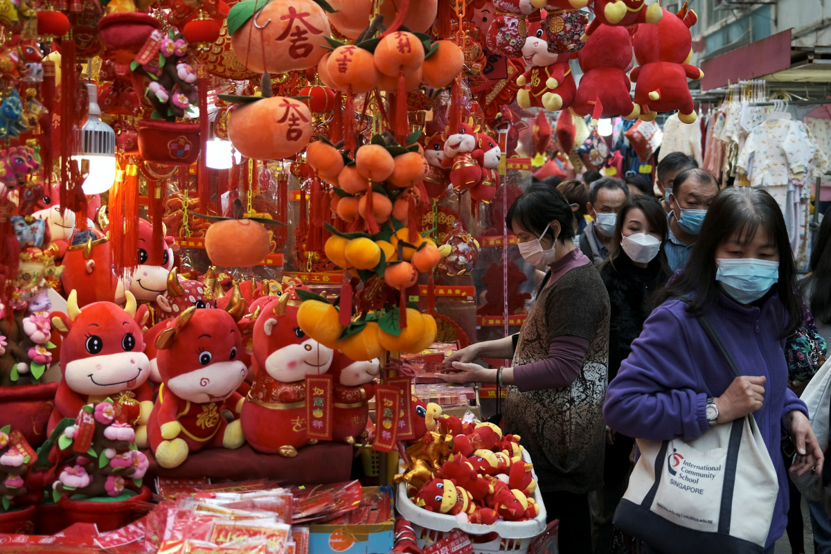 Customers wearing face mask shop for decorations, ahead of the Chinese Lunar New Year, following the coronavirus disease (COVID-19) outbreak, in Hong Kong, China January 28, 2021. REUTERS/Tyrone Siu
