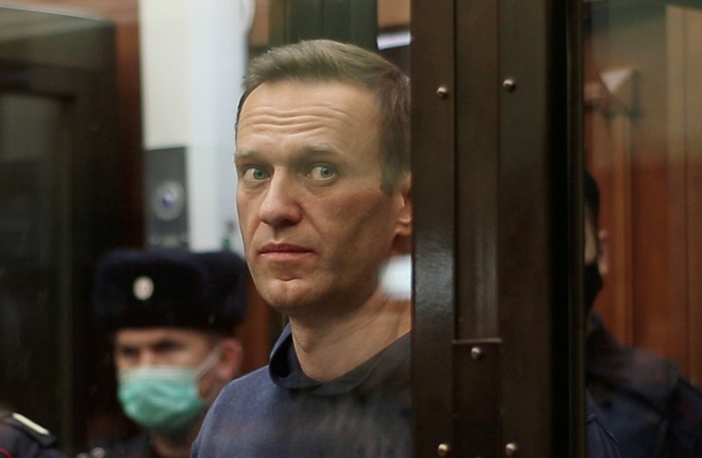 A still image taken from video footage shows Russian opposition leader Alexei Navalny, who is accused of flouting the terms of a suspended sentence for embezzlement, inside a defendant dock during the announcement of a court verdict in Moscow, Russia Febr