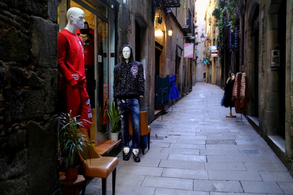 Mannequins are seen on an empty street in Barrio Gotico (Gothic Quarter), after Catalonia's government imposed new restrictions in an effort to control the spread of the coronavirus disease (COVID-19), in Barcelona, Spain January 26, 2021. REUTERS/Nacho D