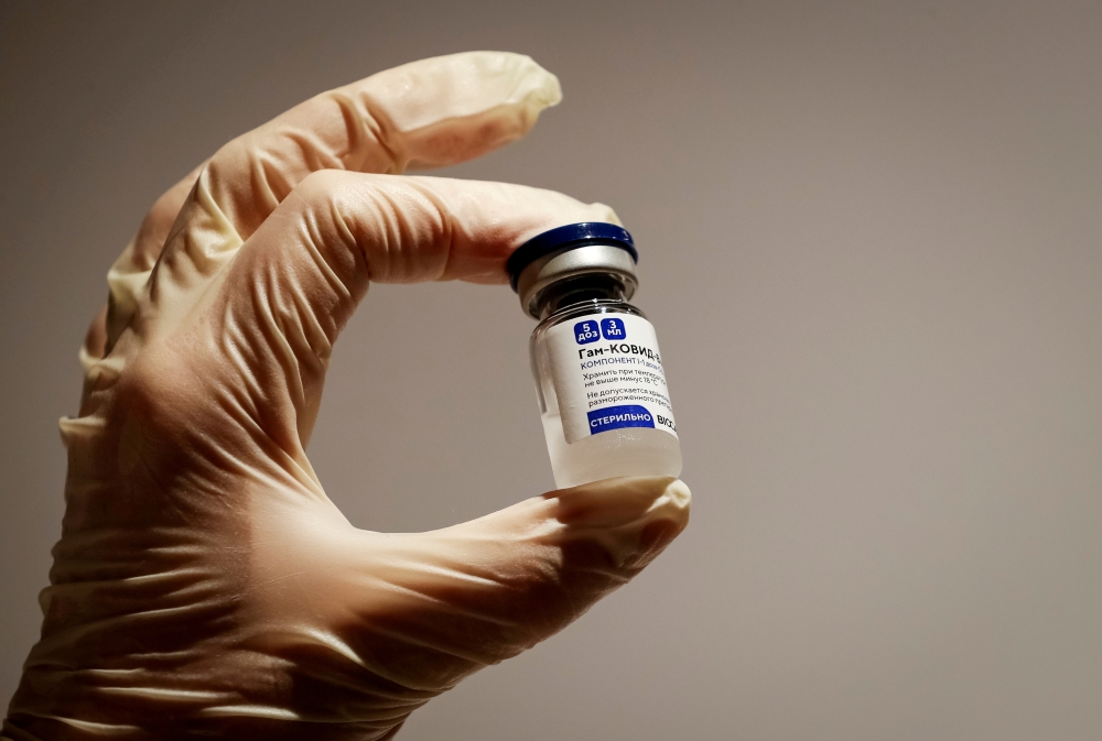 File photo: A medical specialist holds a vial of Sputnik V vaccine against the coronavirus in a department store in Moscow, Russia, January 18, 2021 REUTERS/Shamil Zhumatov/File Photo