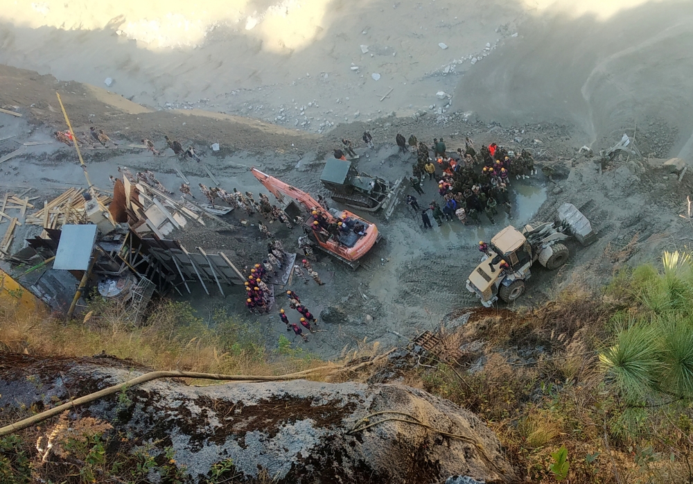 Rescue team members work near a tunnel after a part of a glacier broke away and caused flood in Tapovan, northern state of Uttarakhand, India, February 8, 2021. REUTERS/Stringer