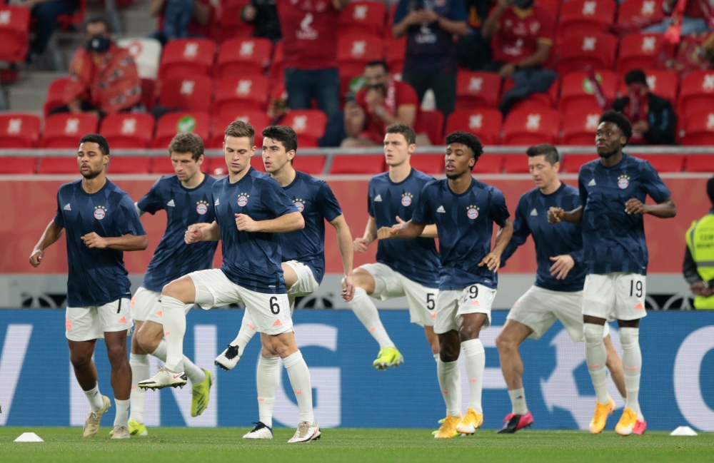 Bayern Munich's Joshua Kimmich with teammates during the warm up before the match REUTERS/Mohammed Dabbous
