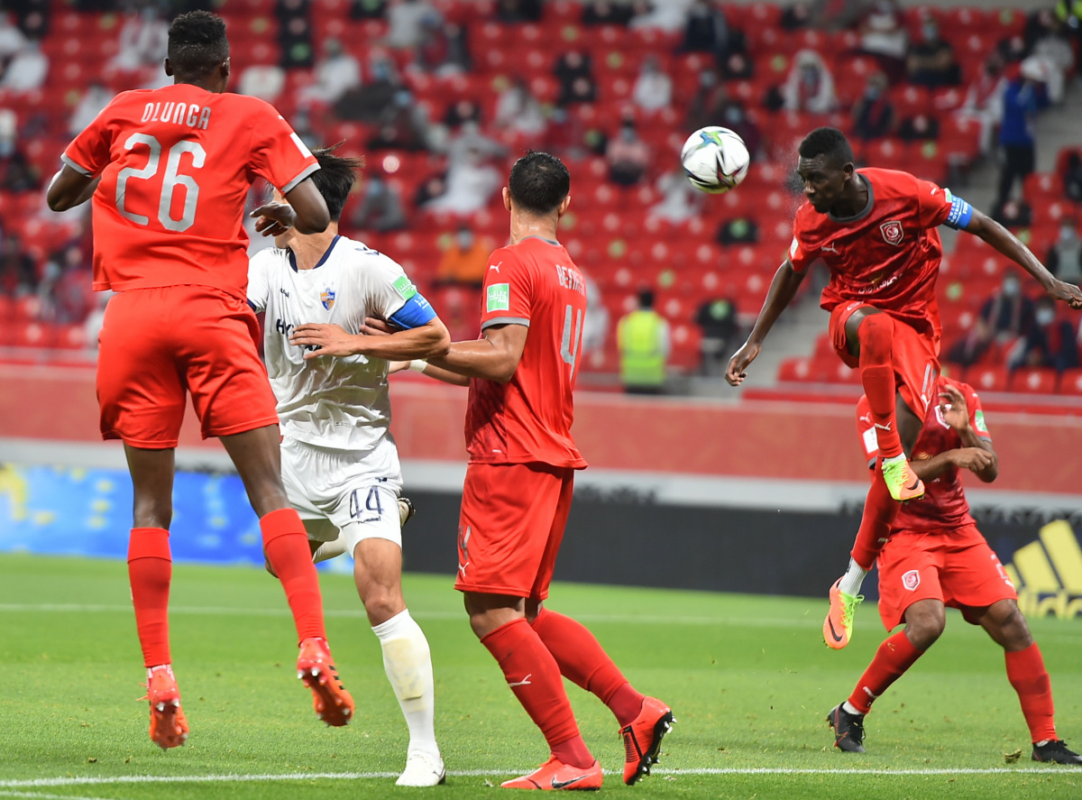 Al Duhail's Almoez Ali heads the ball as he attempts to score.