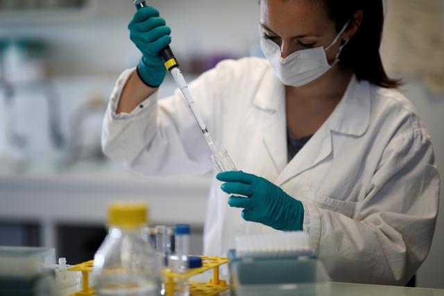 FILE PHOTO: A water quality scientist, conducts tests on a water sample at the Eau de Paris research and analysis laboratories in Ivry-sur-Seine, near Paris, France, July 22, 2020. REUTERS/Benoit Tessier