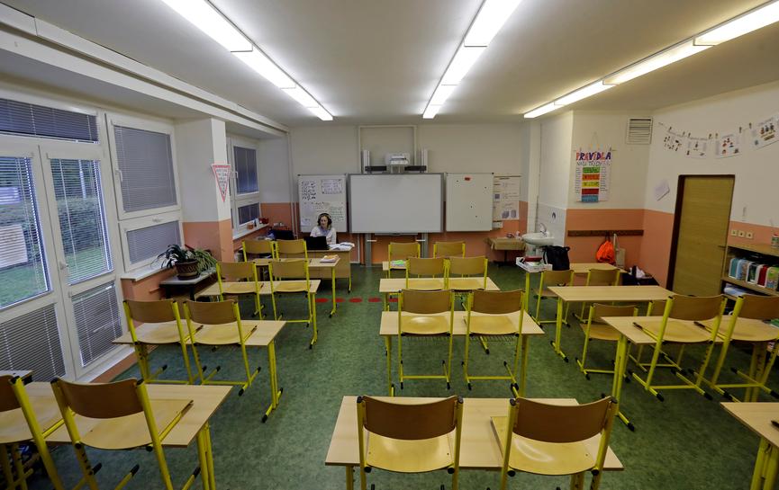 FILE PHOTO: A teacher conducts an online class with pupils receiving distance education inside an empty classroom, as the Czech government shut all schools for two weeks to slow down the spread of the coronavirus disease (COVID-19), at a closed school in 