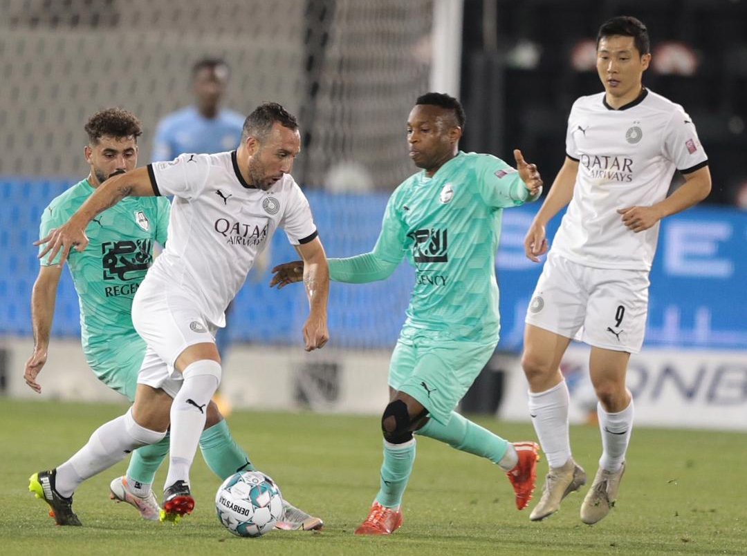 Al Sadd's Santi cazorla in action against Al Ahli players. 