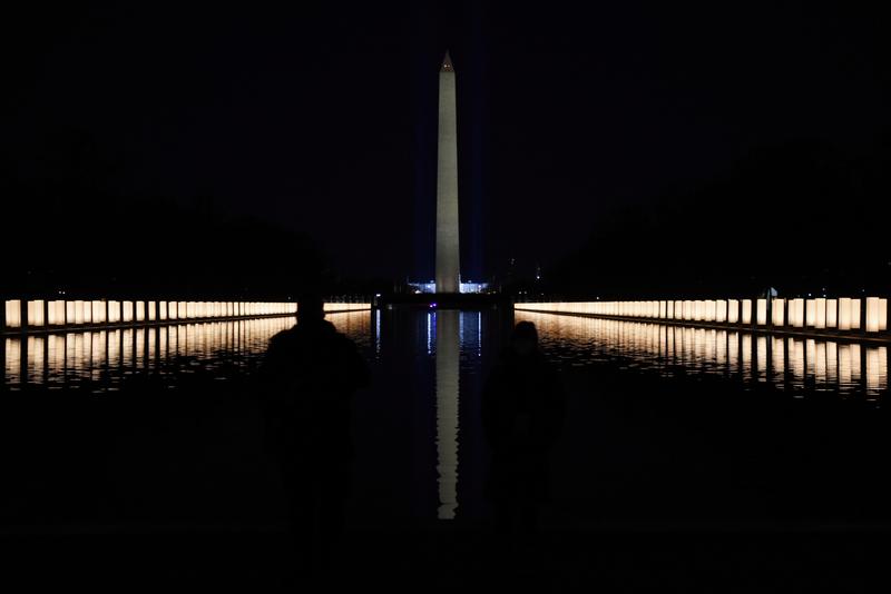 The Washington Monument is seen reflected after President-elect Joe Biden hosts a memorial to honor those who died from coronavirus disease (COVID-19), at the reflecting pool at the Lincoln Memorial, in Washington, U.S., January 19, 2021.    REUTERS/Calla