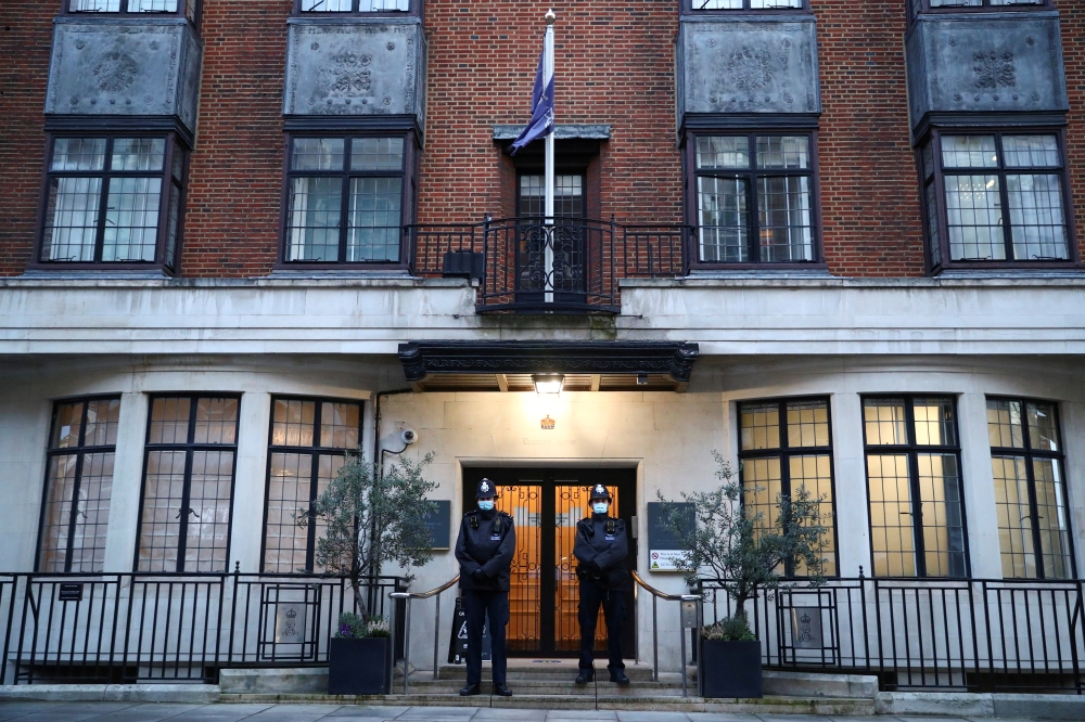 Police officers stand outside King Edward VII's Hospital, where Britain's Prince Philip was admitted, in London, Britain, February 18, 2021. REUTERS/Hannah McKay