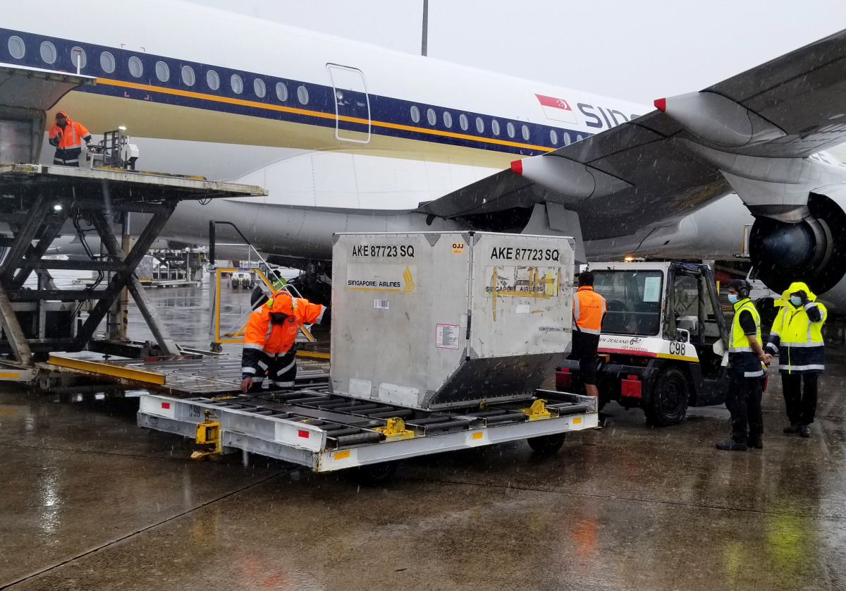New Zealand's first batch of Pfizer-BioNTech coronavirus disease (COVID-19) vaccines is unloaded from a plane after arriving in Auckland, New Zealand, February 15, 2021. Ministry of Health, New Zealand Government/Handout via REUTERS 