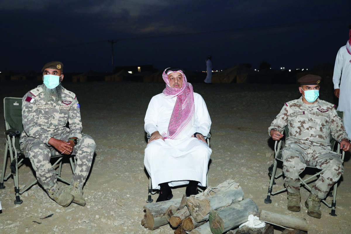 Deputy Prime Minister and Minister of State for Defence Affairs H E Dr. Khalid bin Mohammed Al Attiyah with officials of National Service Academy. 