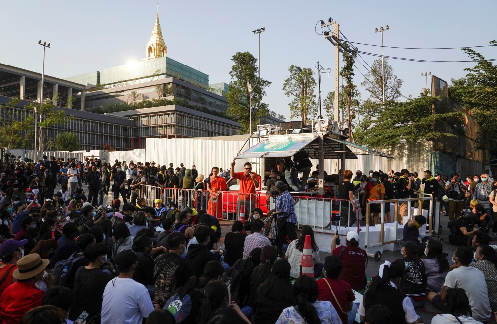 Pro-democracy protesters gather during a rally after Thailand's Prime Minister Prayuth Chan-ocha and nine ministers survived no-confidence debates, outside the Parliament in Bangkok, Thailand, February 20, 2021. REUTERS/Athit Perawongmetha