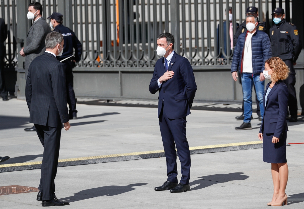 President of the Congress of Deputies Meritxell Batet and Prime Minister Pedro Sanchez greet King Felipe upon arrival for an event marking the 40th anniversary of the February 23, 1981 coup attempt, at the Parliament in Madrid, Spain, February 23, 2021. R