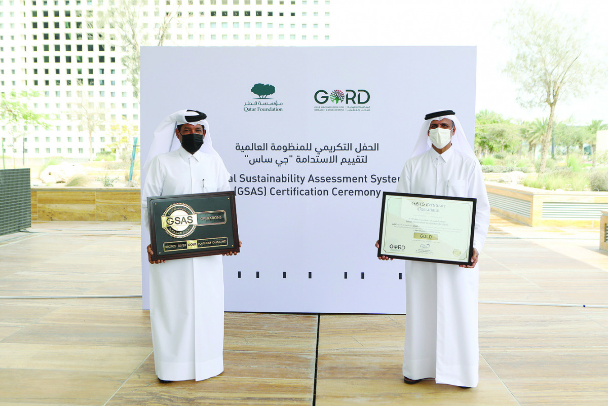 Executive Director, City Operations at QF, Hamad Mohamed Al Kuwari, and Founding Chairman of Gulf Organisation for Research and Development, Dr. Yousef Alhorr, during a ceremony to mark Qatar Foundation’s headquarters being awarded with Global Sustainabil