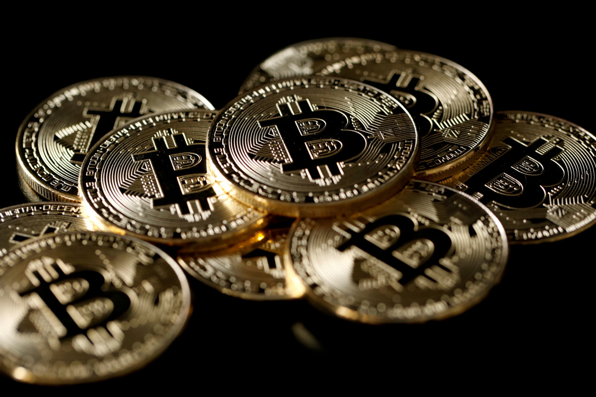 FILE PHOTO: A collection of bitcoin (virtual currency) tokens are displayed in this picture illustration taken Dec. 8, 2017. REUTERS/Benoit Tessier/Illustration/File Photo
